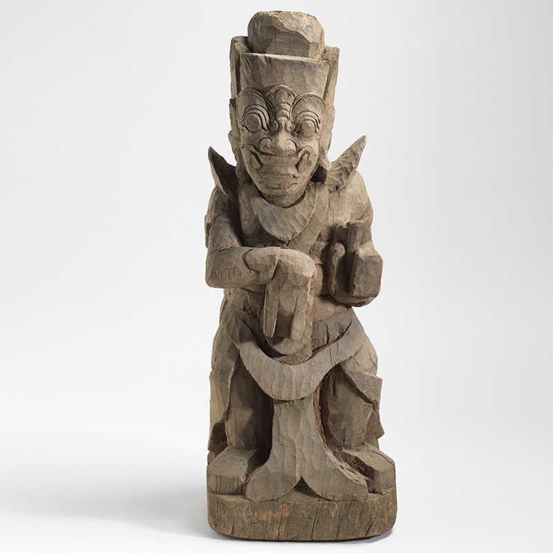 Male guardian figure with fangs