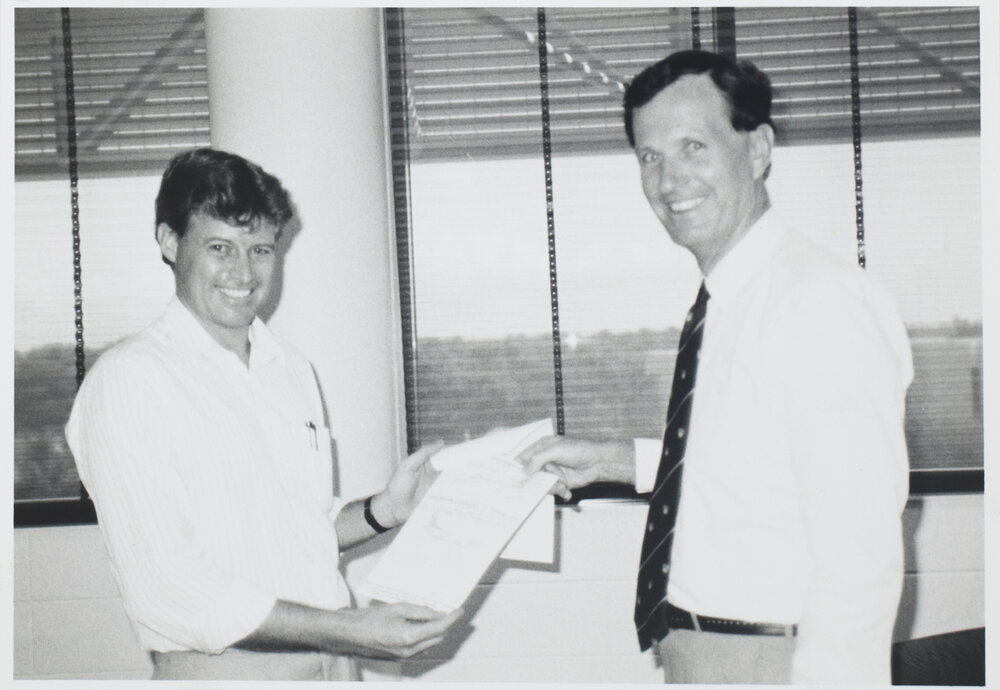 ANSETT Manager presents a cheque