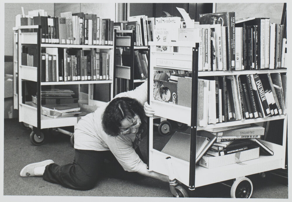 Staff move books from the old building to the new one 2