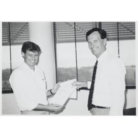 ANSETT Manager presents a cheque