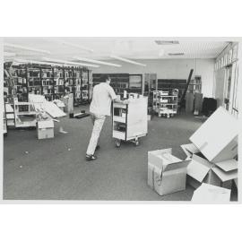 Staff move books from the old building to the new one 1