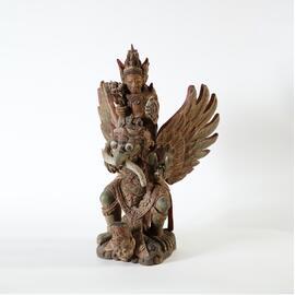 Vishnu riding Garuda with naga in mouth