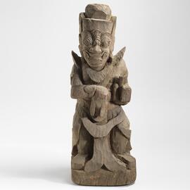Male guardian figure with fangs