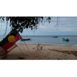 Aust flags on beach Watebo village