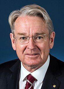 From Hon Richard Court AC DFAT HOM. Official Portrait. Parliament House Canberra 30 November 2016, by David Foote AUSPIC/DPS, https://en.wikipedia.org/wiki/Richard_Court#/media/File:Richard_Court_-_Ambassador_to_Japan_b.jpg, CC BY 4.0.